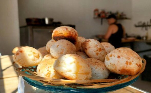 A basket filled with freshly baked Brazilian pão de queijo
